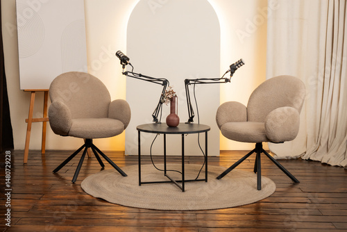 Cozy podcast studio setup with microphones, seating area, and decorative elements for engaging conversations