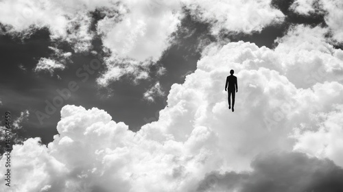 Silhouette walking in the sky surreal cloudscape monochrome dreamlike scene