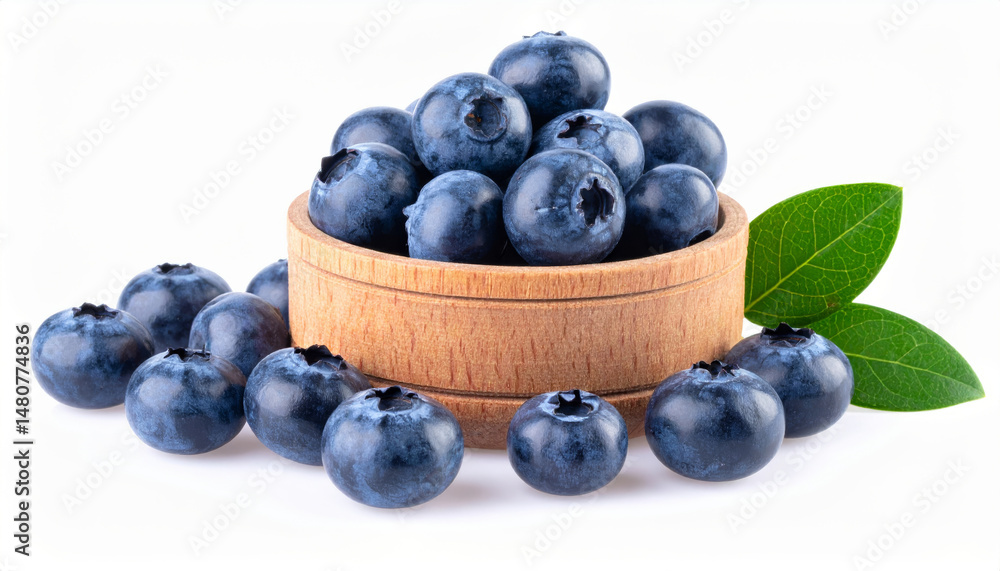 Fresh blueberries spilling from wooden bowl on white background Fresh blueberries spilling from wooden bowl on white background