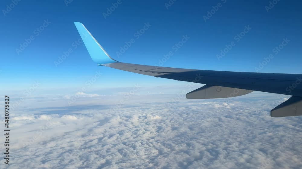 Clouds and sky view through window of aircraft Clouds and sky view through window of aircraft