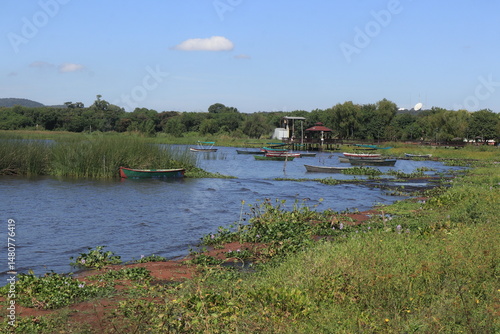Small fishing boats along the shoreline of Lake Ypacaraí near Areguá, Paraguay