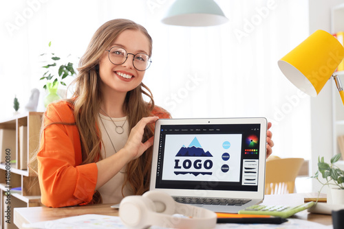 Female web designer with la...