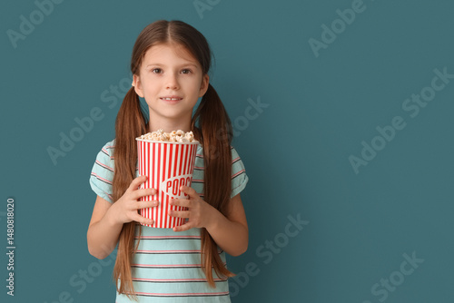 Little girl with popcorn on...