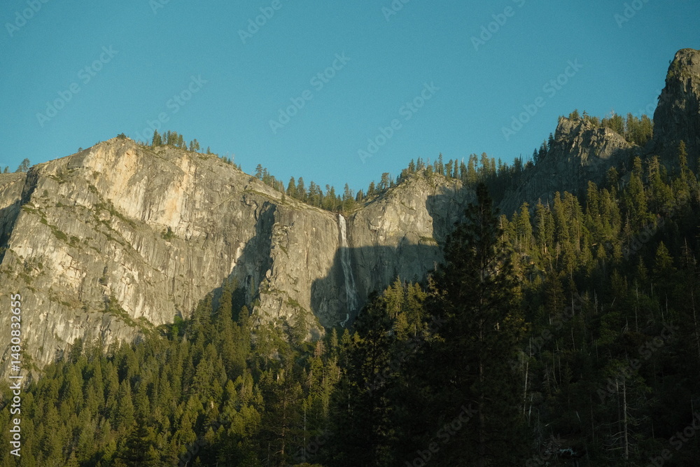 Yosemite National Park in California’s Sierra Nevada mountains green foliage on sunny day beautiful landscape Yosemite National Park in California’s Sierra Nevada mountains green foliage on sunny day beautiful landscape