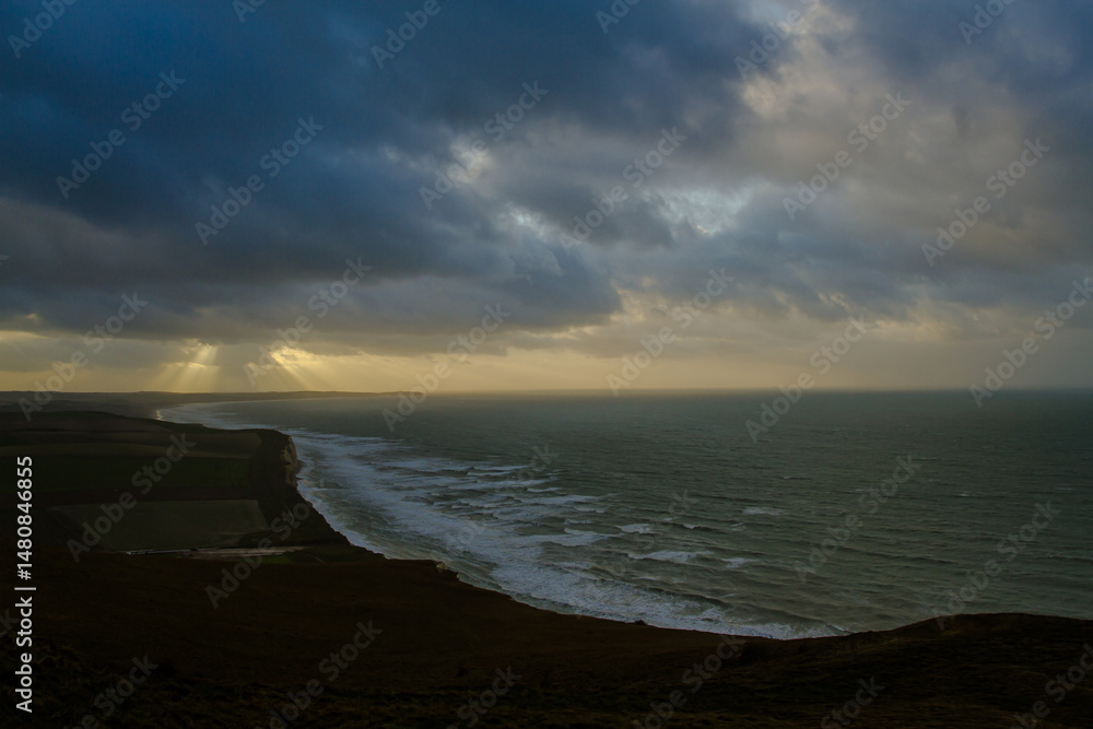Coast line with cliff against dramatic sky. English Channel viewed from french beaches. Coast line with cliff against dramatic sky. English Channel viewed from french beaches.
