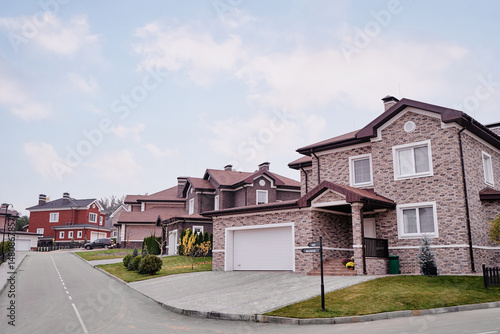 Modern Suburban Brick House in Peaceful Residential Area on Sunny Day..