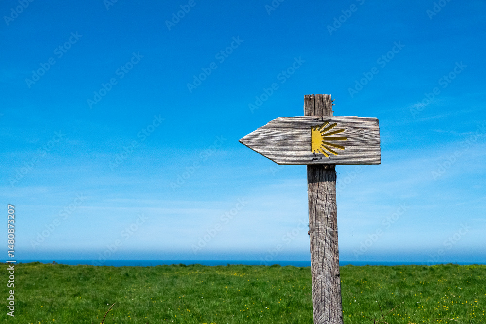 Waymarking with blue sky and Scallop Shells on the Camino de Santiago or the Way of Saint James. Santiago de Compostela pilgrimage. Waymarking with blue sky and Scallop Shells on the Camino de Santiago or the Way of Saint James. Santiago de Compostela pilgrimage.