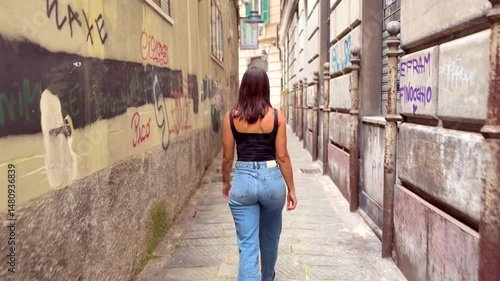 Young Woman Walking Through Picturesque Streets of Cinque Terre, Italy, Rear View in Colorful Mediterranean Village