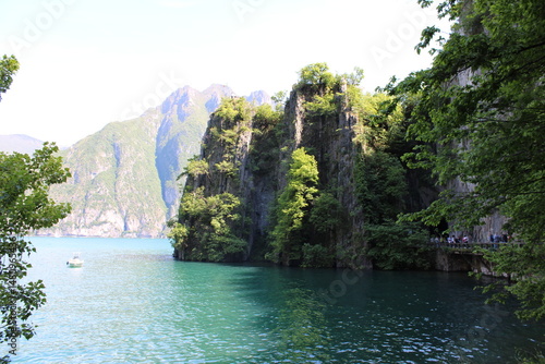 Εκτύπωση καμβά Baia del Bogn, in Riva di Solto on Lake Iseo, tall rocky cliffs plunge into the emerald green water