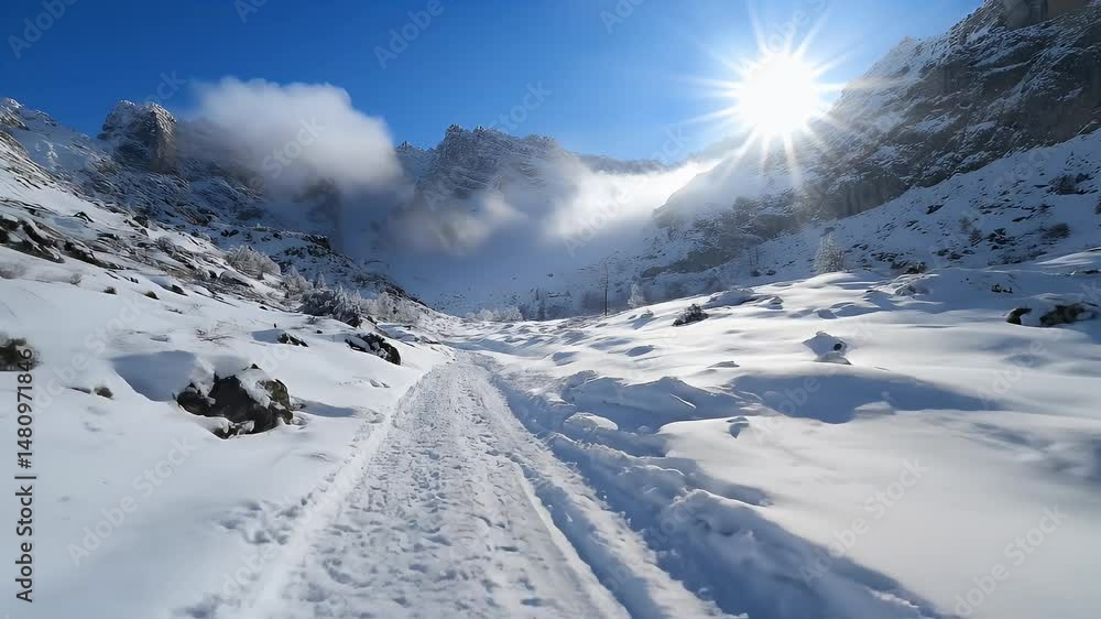 Snowy Mountain Landscape with Bright Sunlight Against Blue Sky in Winter Season Snowy Mountain Landscape with Bright Sunlight Against Blue Sky in Winter Season
