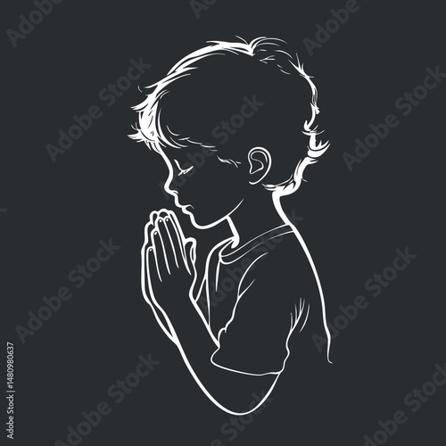 Silhouette of a young boy praying with closed eyes and hands together in a peaceful gesture