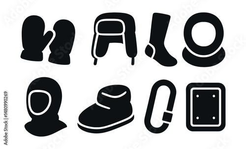 Solid style icons of cold weather accessories: fleece mittens, trapper hat, thermal socks, wool cowl, windproof hood, foot warmer, coat clip, heat patch.