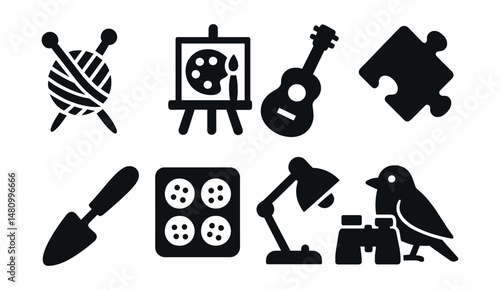 Solid style icons of hobby activities: knitting needles, painting board, guitar icon, puzzle piece, gardening tool, baking tray, reading lamp, birdwatching icon.