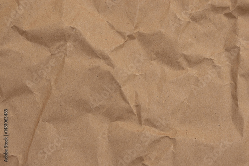 Crumpled brown butcher paper with wrinkled and textured background