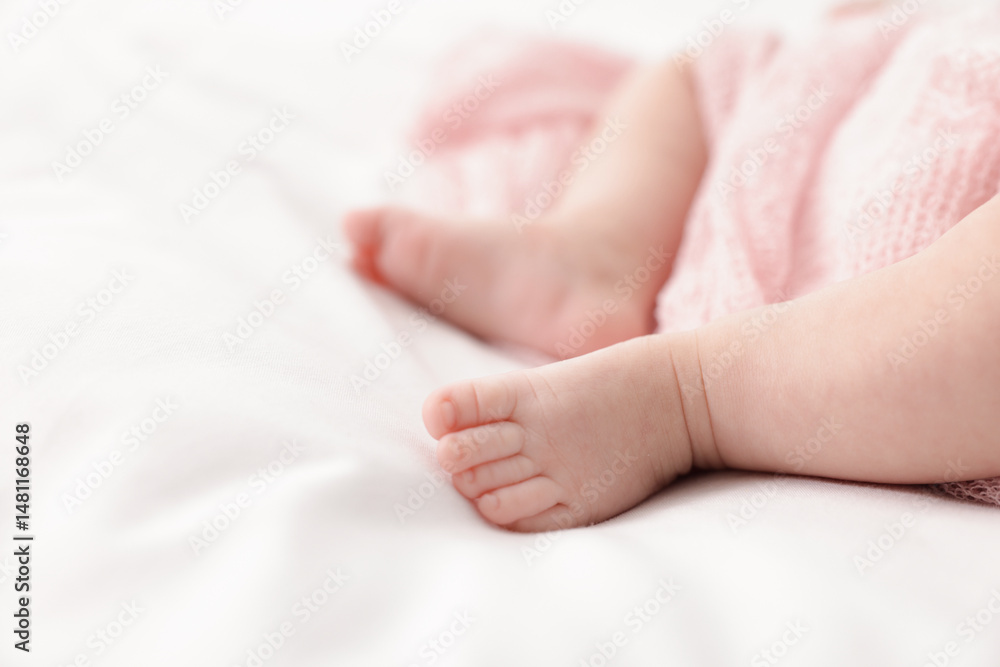 Cute little baby lying on bed at home, closeup. Space for text Cute little baby lying on bed at home, closeup. Space for text
