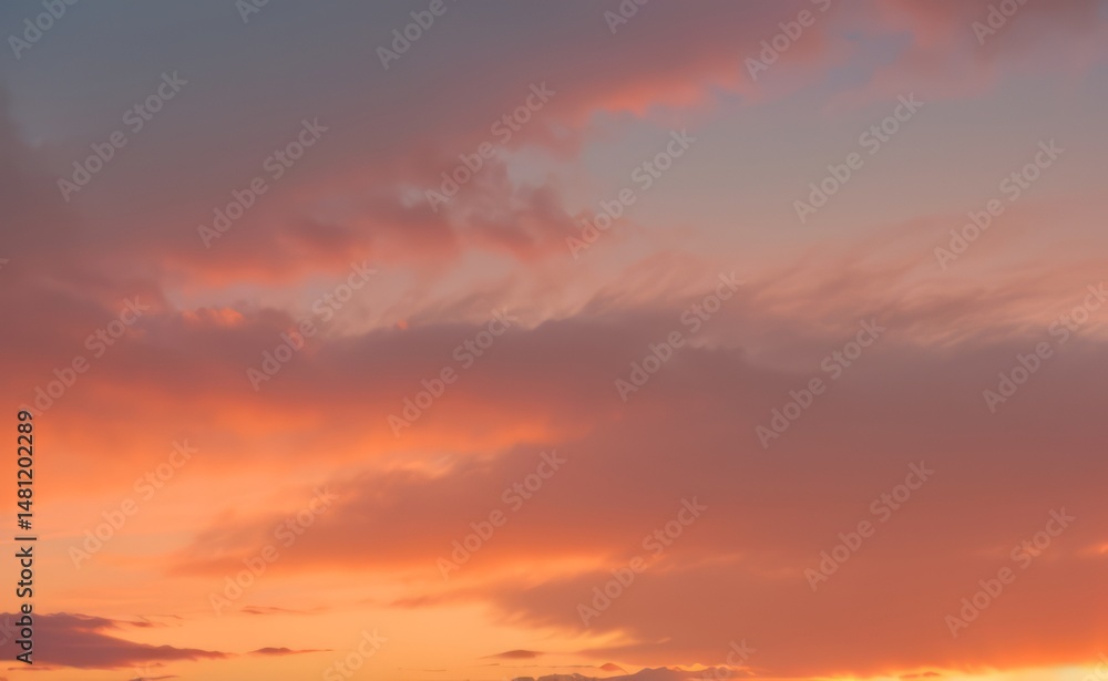 Fototapeta premium Sky with clouds showing shades of orange pink and purple during sunset.