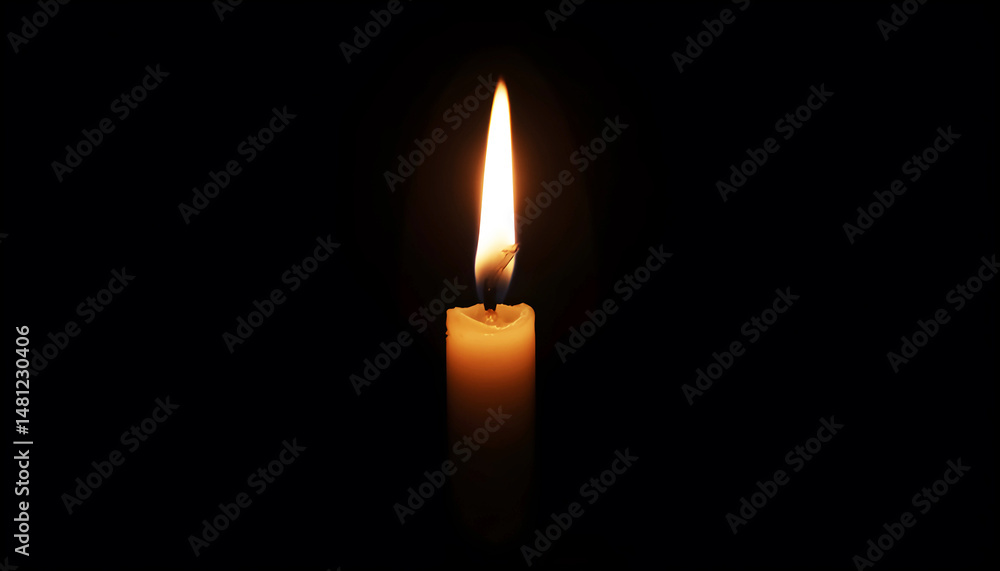A burning candle on a black background in the center. Memorial Day. With copy space. A burning candle on a black background in the center. Memorial Day. With copy space.