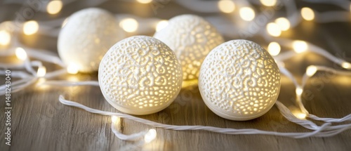 Elegant white decorative balls with intricate designs.