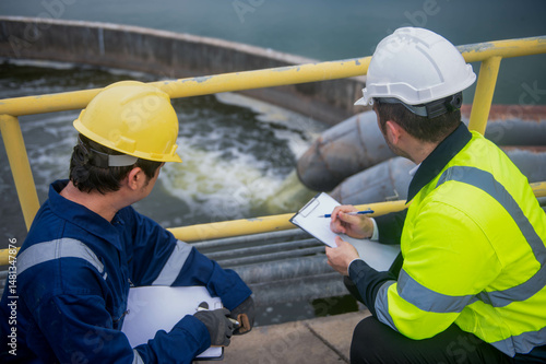 An inspector and a water treatment plant engineer are working together to plan a change in the treatment plant's water filter to bring the water up to state standards.