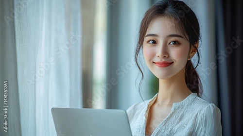 Free Download Asian woman smiling with laptop in cozy room lifestyle photography natural light - GFXLoad