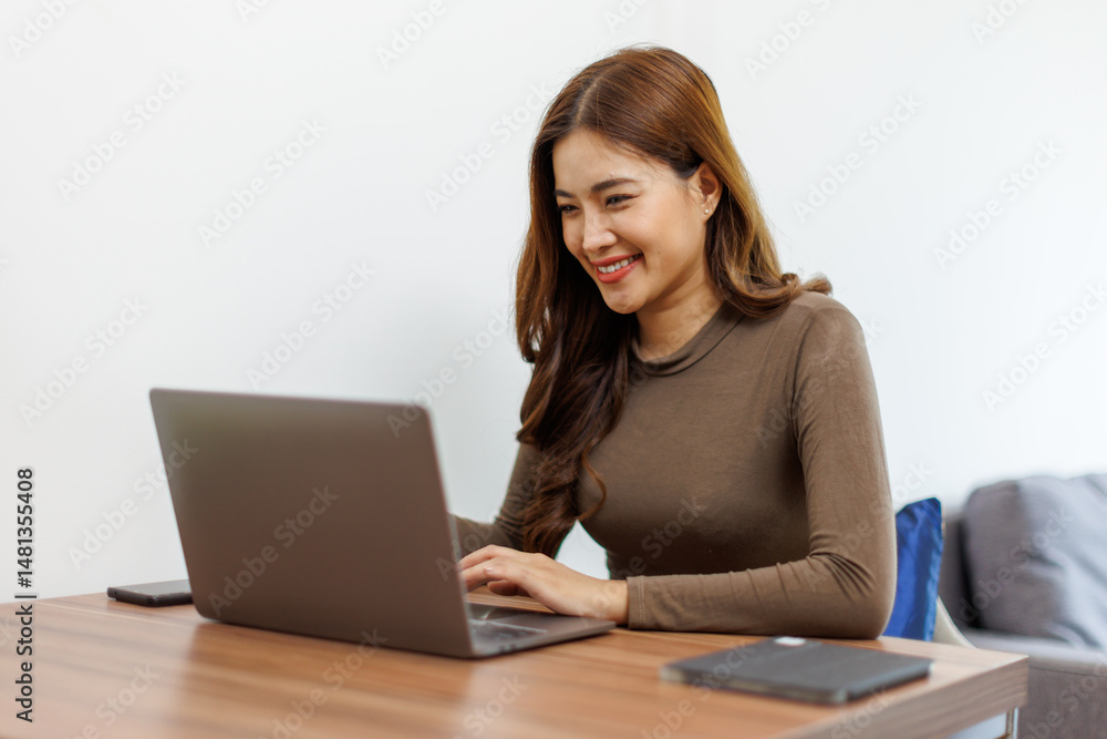 Image of young asian happy cheerful cute beautiful business Asian woman sit indoors in home office using laptop computer work in a video conference on line
Image of young asian happy cheerful cute beautiful business Asian woman sit indoors in home office using laptop computer work in a video conference on line