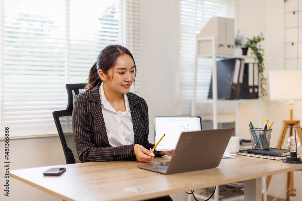 Business of asian woman financial data analyst using calculator and laptop for do math finance on wooden desk, tax, accounting, statistics and analytical research concept
Business of asian woman financial data analyst using calculator and laptop for do math finance on wooden desk, tax, accounting, statistics and analytical research concept