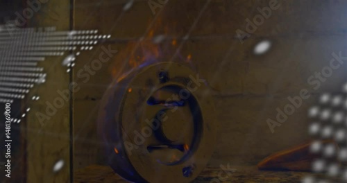 Displaying circular metal flange with wedge, dotted world map, scrolling text, flickering flames