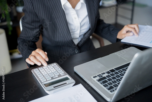 business man Auditor or internal revenue service staff checking annual financial statements company Audit  Accounting tax photo