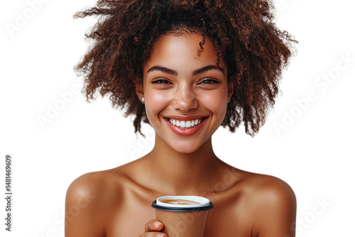 A woman with curly hair smiles brightly holding coffee cup, natural light and freckles visible, isolated on a transparent background