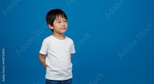 Photo of Curious Boy in Whi...