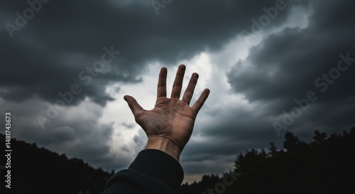 Photo of Hand Reaching Towa...