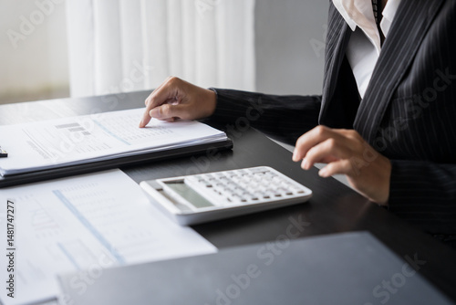 business man Auditor or internal revenue service staff checking annual financial statements company Audit  Accounting tax photo