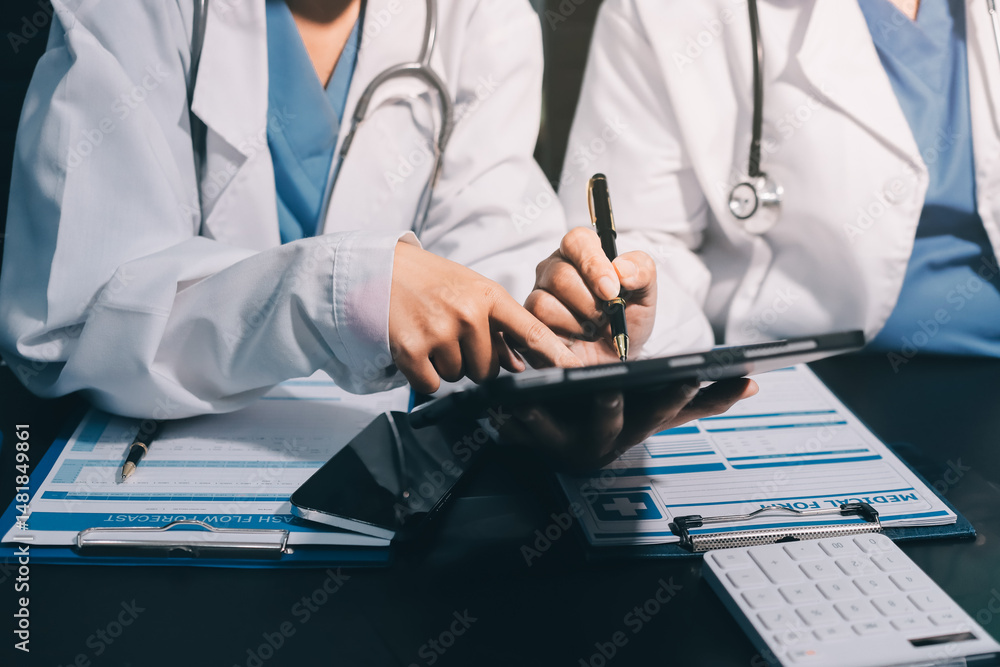 Team of professional doctors having meeting in office Team of professional doctors having meeting in office