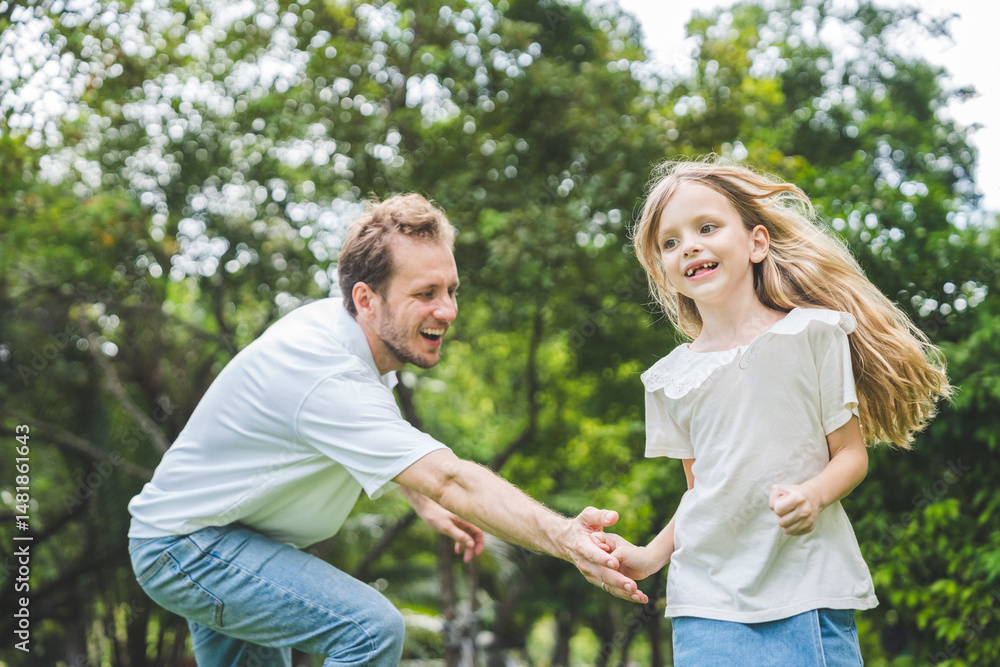 Fototapeta premium Happy family parent children having picnic outdoor activity. Enjoy happiness moment summer playing together including father mother son and daughter relaxing in the morning sunrise.