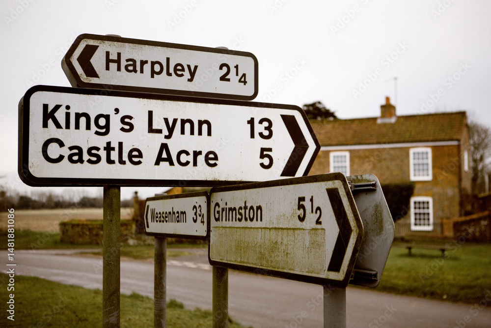 Fototapeta premium Weathered arrow road signs in Great Massingham, UK