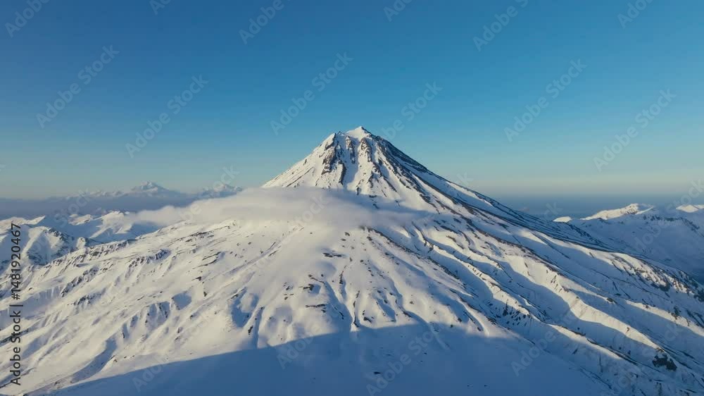 Aerial view of snow-capped mountains and volcano peaks Aerial view of snow-capped mountains and volcano peaks