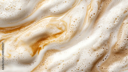 Creamy coffee foam with rich caramel swirls.