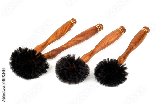Dark round brushes wooden handles