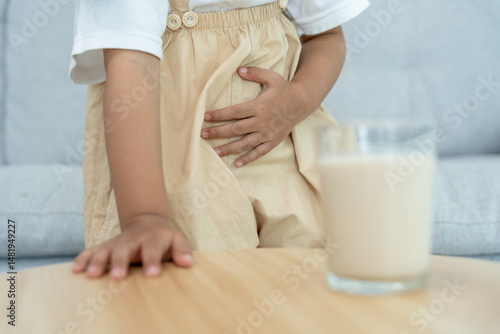 Quadro em tela Milk allergens, children felling stomachache and diarrhea , runny stuffy sore nose suffer from intolerance allergy trigger symptoms
