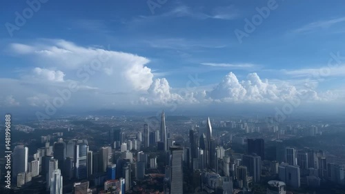 Wallpaper Mural Aerial view over dense skyscraper buildings, urban cityscape, with bright blue sky, white clouds in a developing nation. Torontodigital.ca