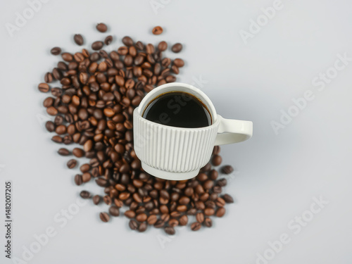 Black Coffee in White Ribbed Mug Surrounded by Roasted Beans Flat Lay
