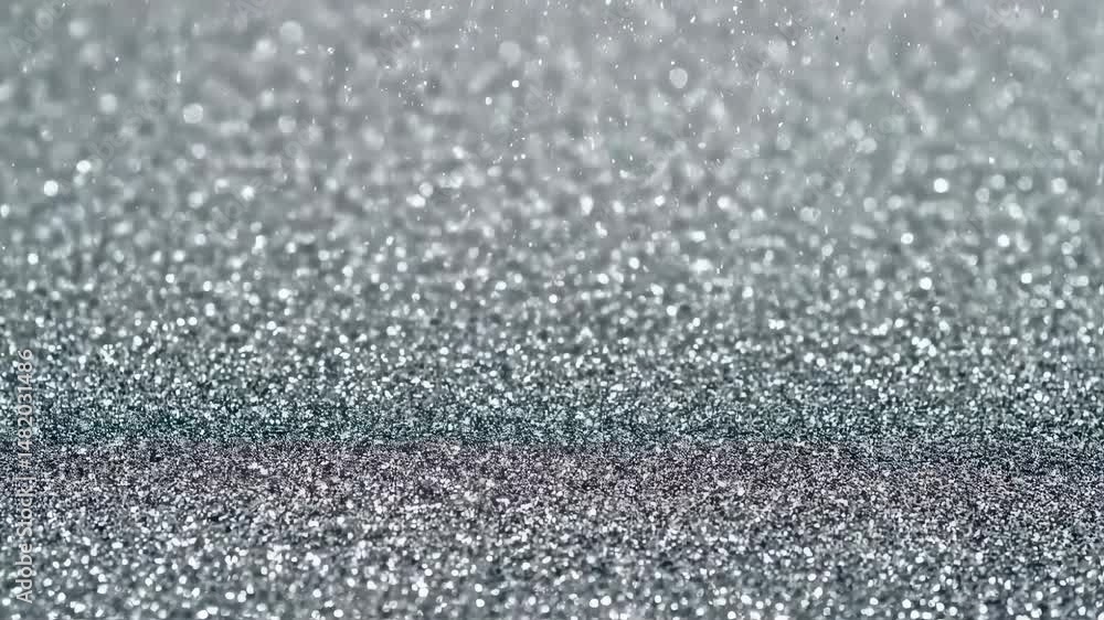 Silver Glitter Cascade: Elegant shimmering background. Perfect for holiday celebrations or luxury brand promotions. Festive mood with magical sparkles. Silver Glitter Cascade: Elegant shimmering background. Perfect for holiday celebrations or luxury brand promotions. Festive mood with magical sparkles.