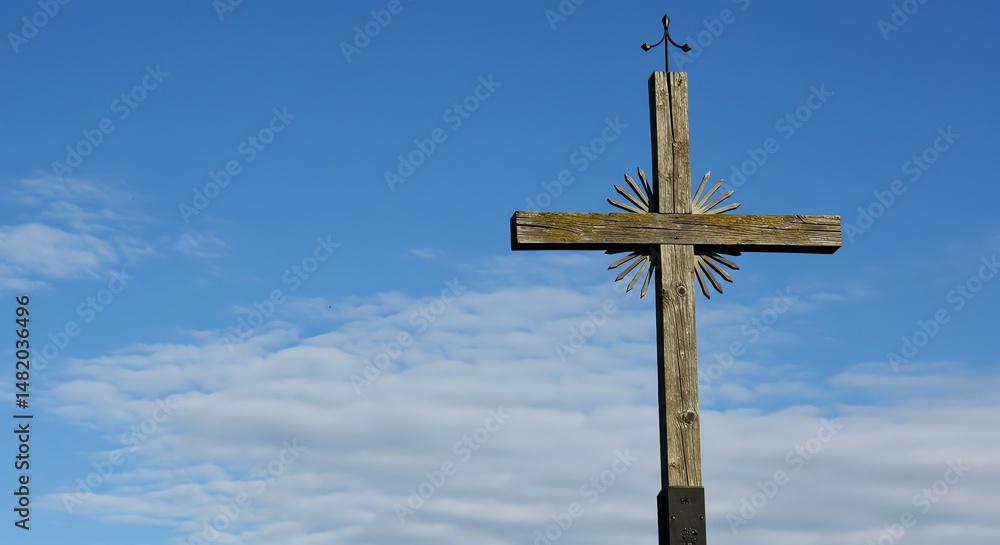 Wooden Cross Against a Blue Sky with Clouds Wooden Cross Against a Blue Sky with Clouds