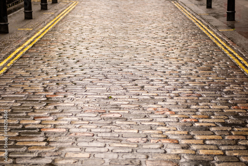 Photography An empty cobbled British London street with space for generative fill or text co