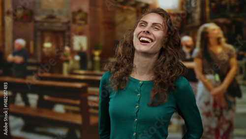 Wallpaper Mural Woman smiling joyfully inside a historic church with ornate interior and blurred visitors in the background, capturing a serene and uplifting atmosphere. Torontodigital.ca