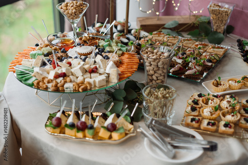 Wedding day. Buffet table with various types of snacks and sweets in the celebration hall