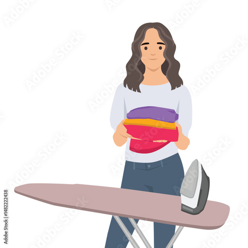Woman beside an ironing board holding neatly folded colorful clothes with an iron nearby. Flat vector illustration isolated on white background