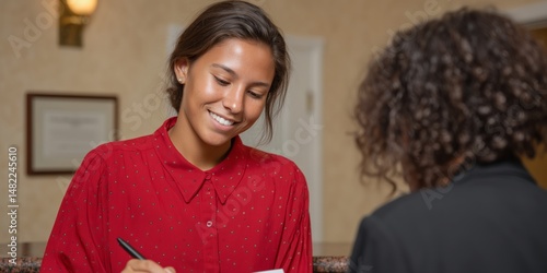 College admissions officer reviewing application documents for student enrollment process