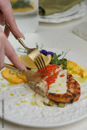 Close-up of fork picking lobster meat on plate