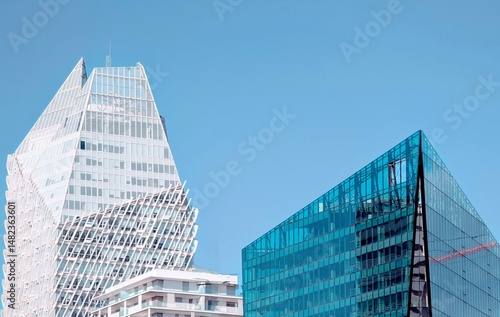 A wide-angle daytime view of the Casa Finance City district in Casablanca, Morocco, showcasing a cluster of contemporary high-rise buildings with unique architectural designs under a clear blue sky
